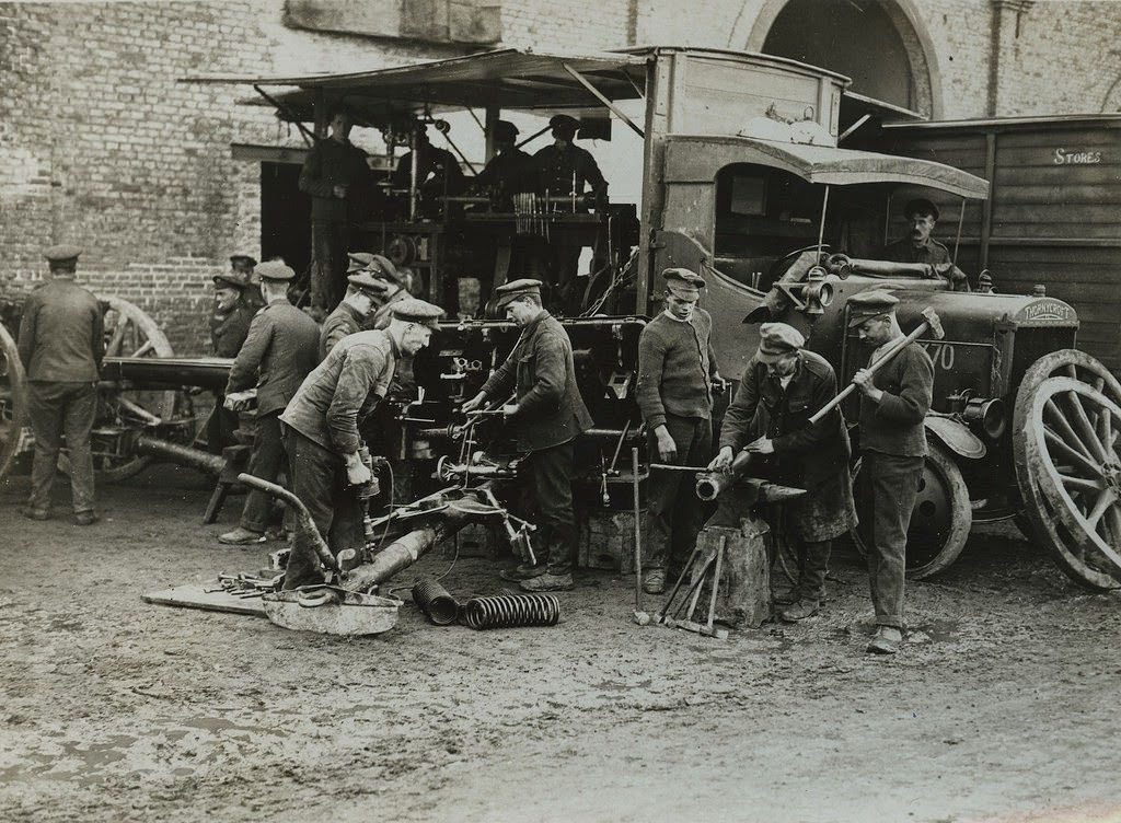The German offensive - Re-assembling and repairing guns at a Travelling Repair Workshop, 1914.