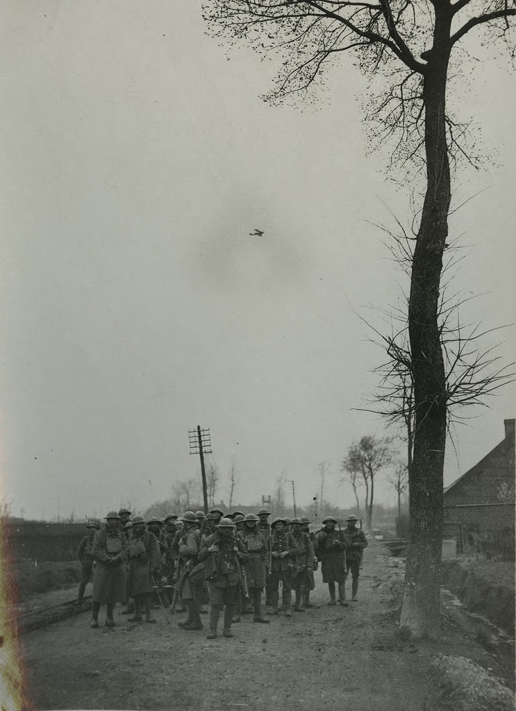 The German offensive - An aeroplane protecting some of the 55th Division waiting to go into action, 1914.