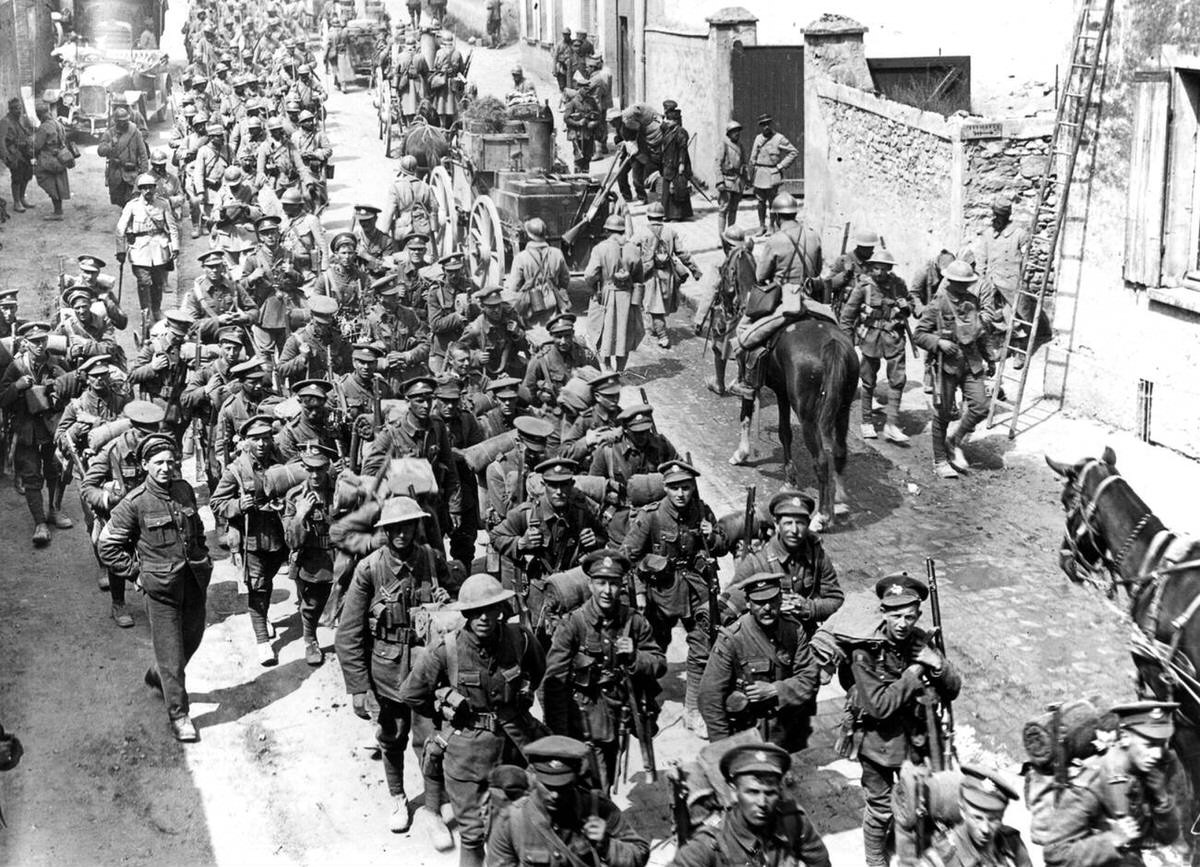 French and British troops marching through Passy-sur-Marne during the Third Battle of the Aisne, 1918