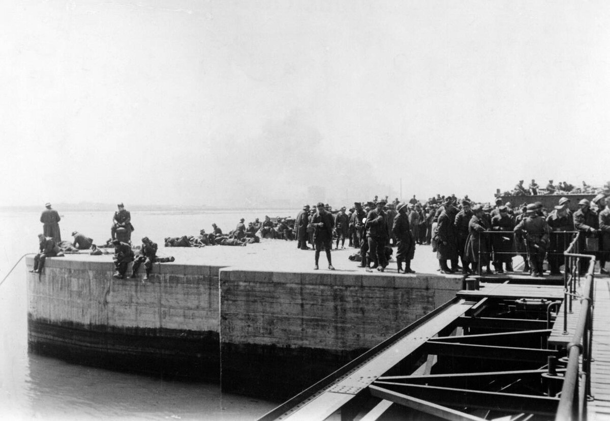 British and French soldiers in the port of Dunkirk waiting for transport to prison camps, 1940