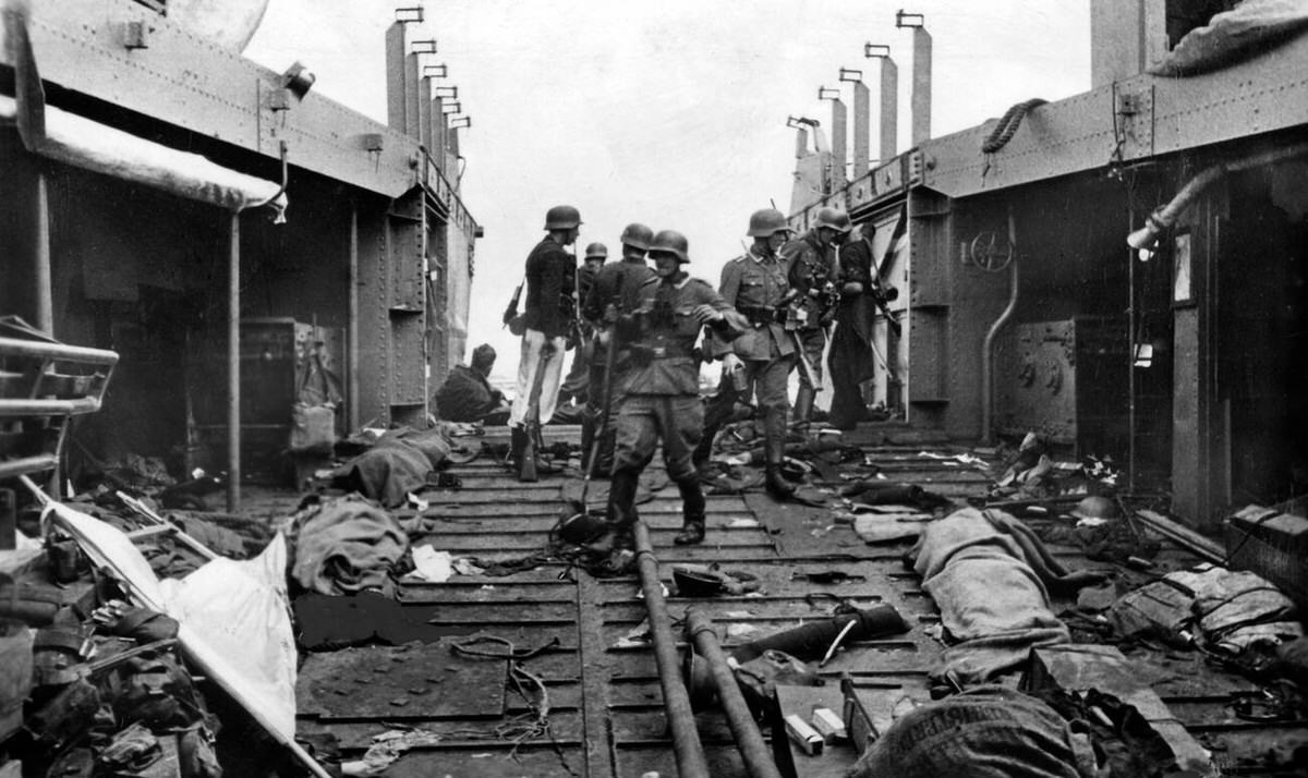 Wehrmacht soldiers searching a British transport ship during Operation Jubilee at Dieppe, 1942