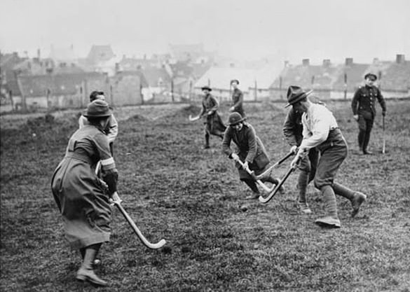 Members of the Women's Army Auxiliary Corps, playing hockey, France. This action photograph is believed to be the work of David McLellan. McLellan was one of five official war propaganda photographers to be commissioned for the Western Front. The first two were Ernest Brooks and John Warwick Brooke. This may have been a personal moment for both McLellan and the players, which has now been caught in time and survives for posterity.