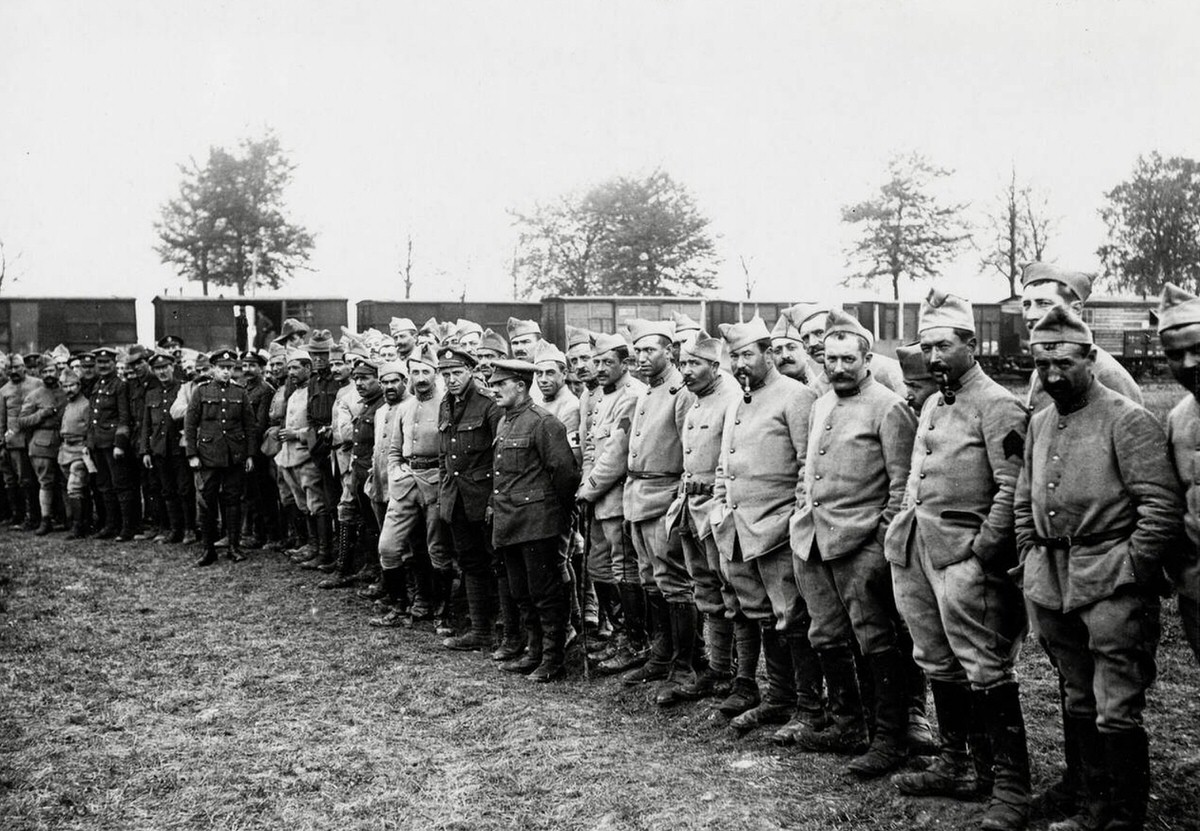 Spectators watching a football match between British and French soldiers near the line in France, 1914