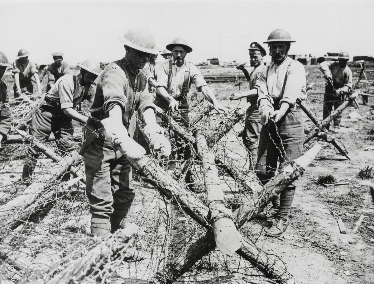 British troops fixing barbed wire to protect their trenches in France, 1914