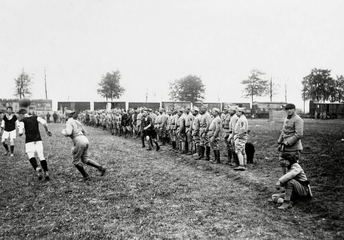 Spectators watching a football match between British and French soldiers in France, 1914