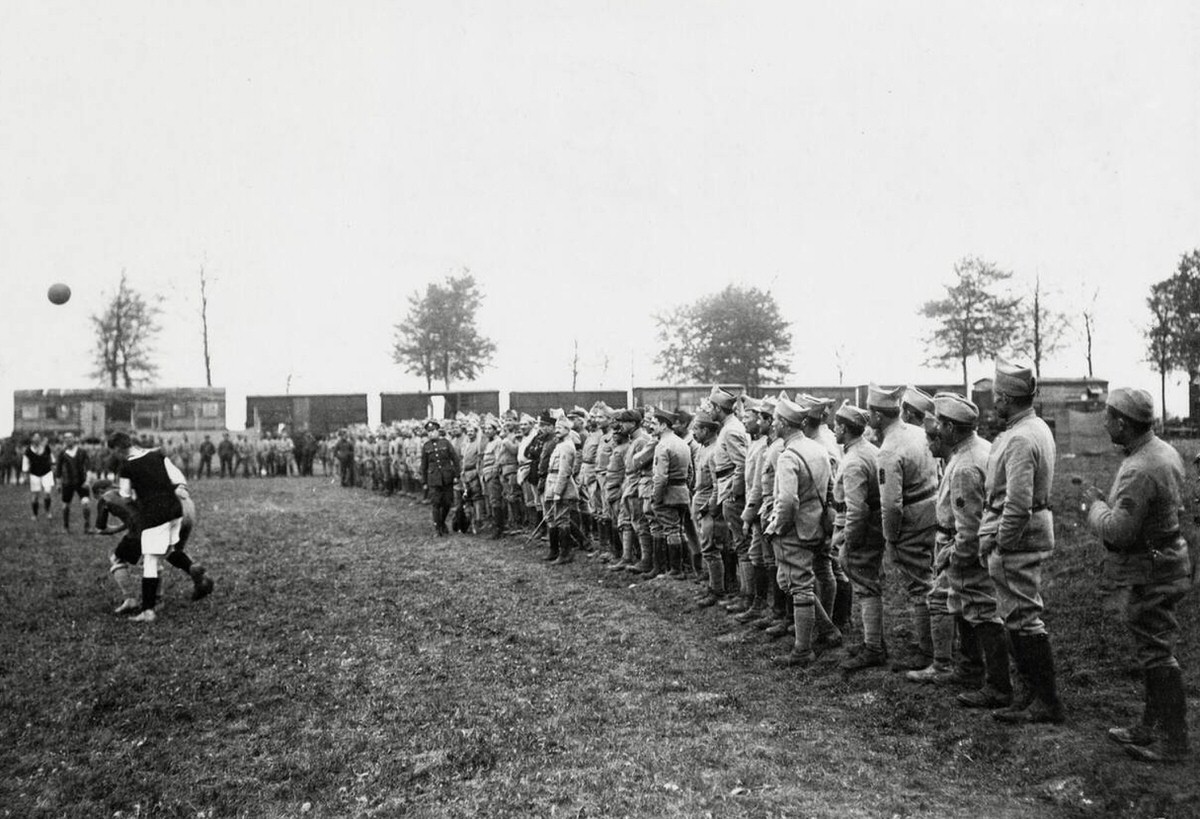 Spectators watching a football match between British and French soldiers in France, 1914