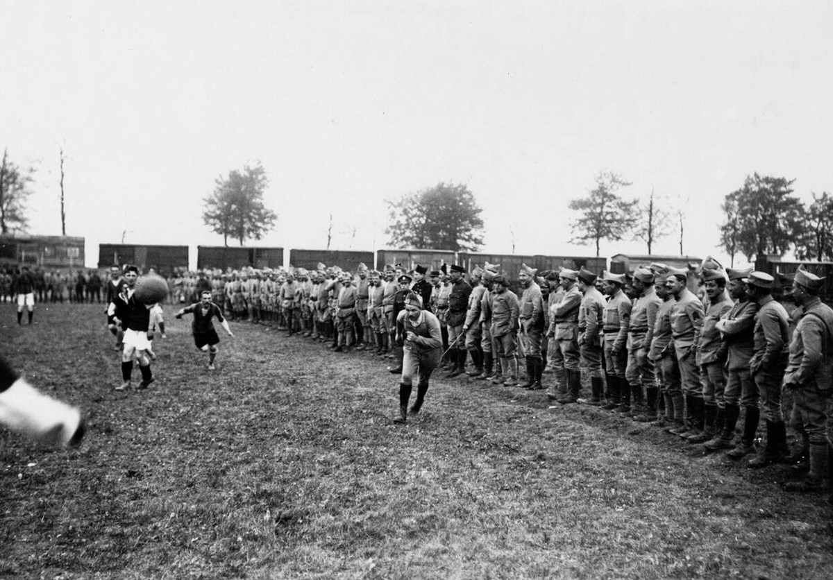 Spectators watching a football match between British and French soldiers in France, 1914