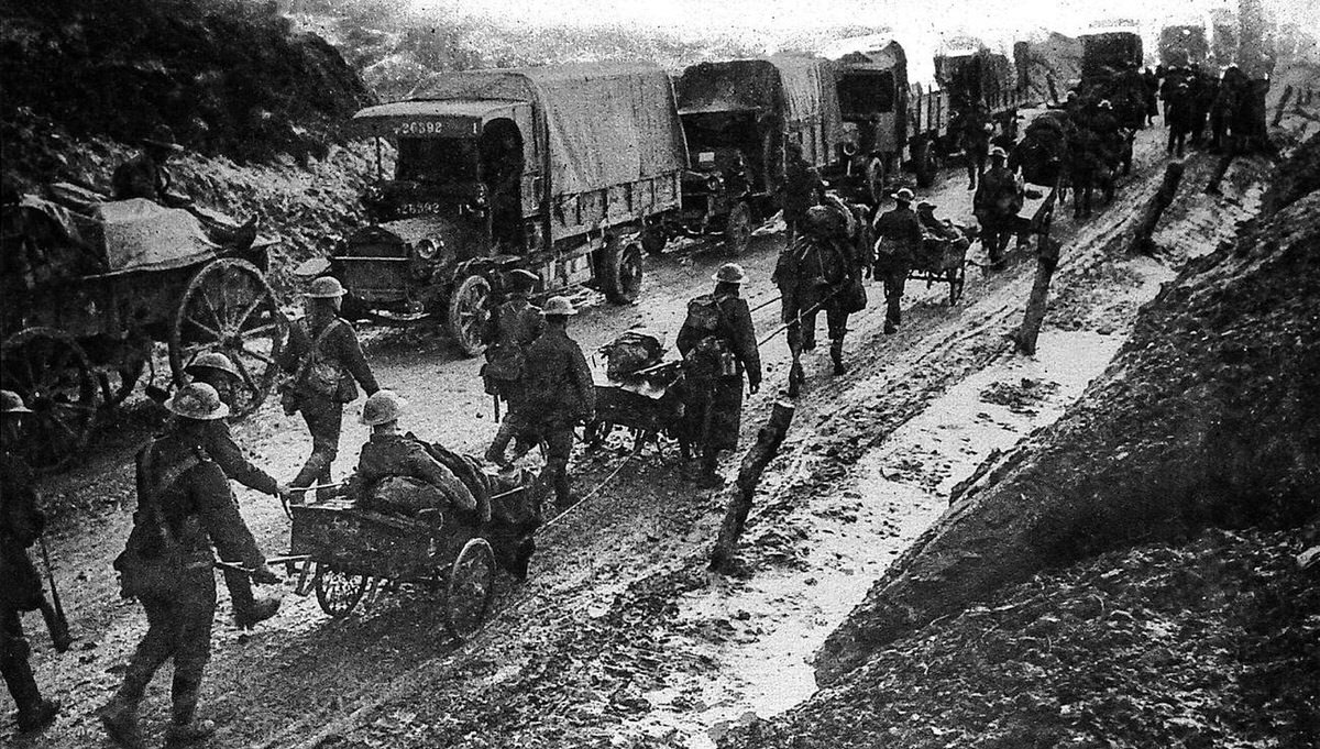 Middlesex Regiment soldiers withdrawing from trenches with munitions and wounded comrades in the Somme, 1916