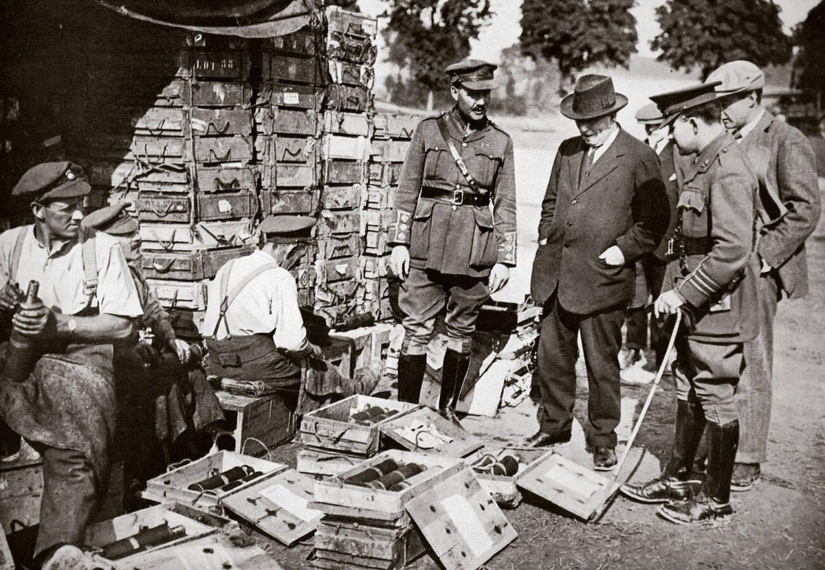 H.H. Asquith watching men adjusting fuses during the Somme campaign in France, 1916
