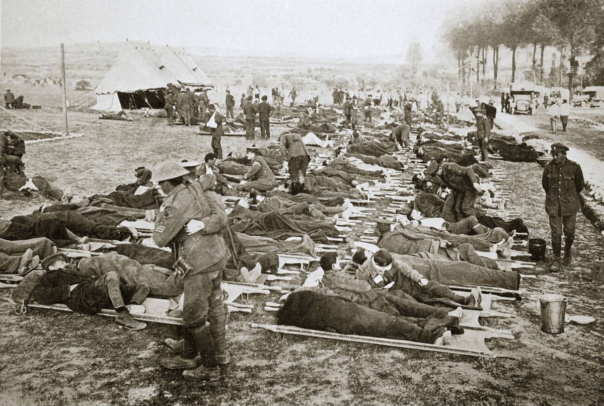 Wounded men waiting to be taken to a clearing station in France, 1916