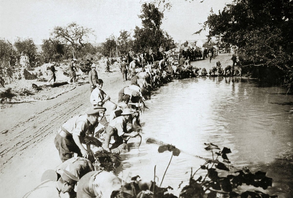 Transport men cleaning their harness at a pond in France, 1916