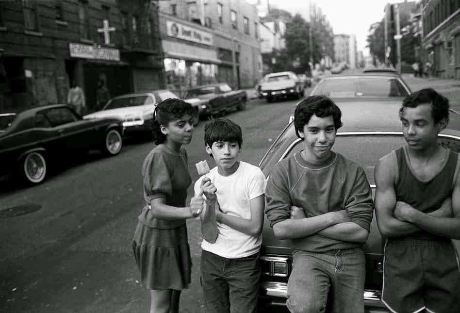 Martin eats ice cream bar as he hangs out with friends, 1982.