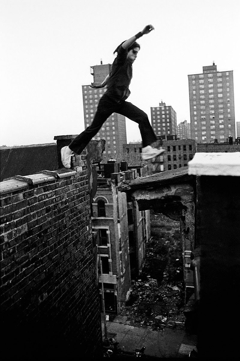 Rafael, 13, jumps from one building to the next, eight stories up, 1977.