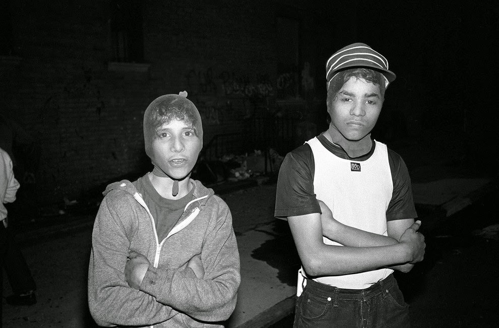 Two teens wear stocking masks they use to hide their identity when they rob people, Bathgate Avenue, 1982.