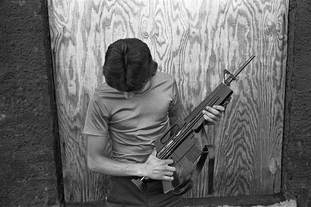 Teenage boy with M-16, 1985.