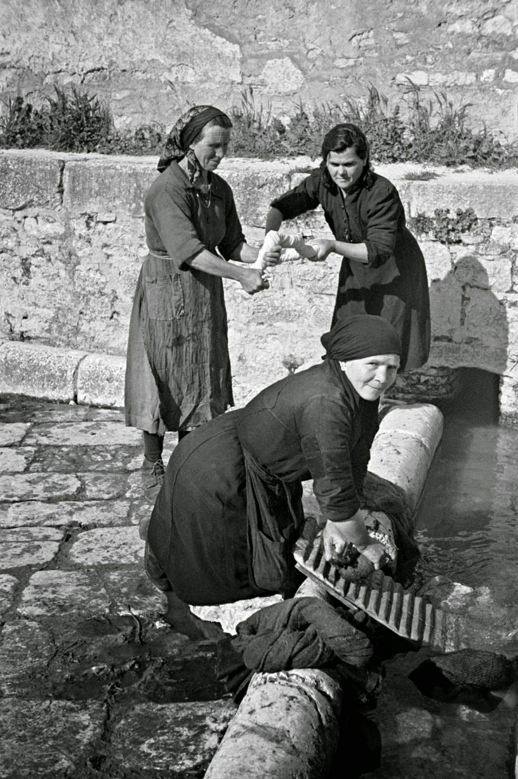 Local women washing clothes in the old Roman washing place in Campobasso