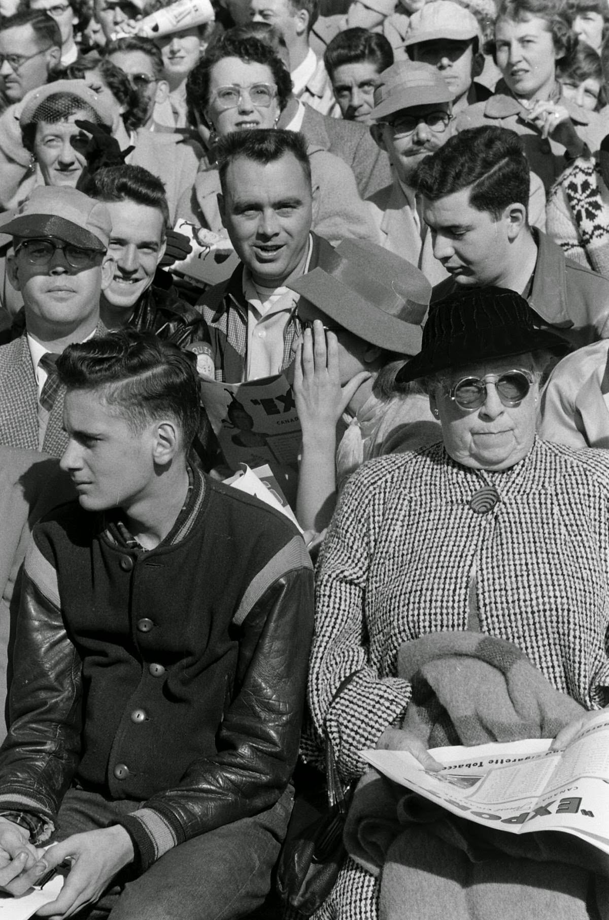 Fans at Canadian college football game, 1954.