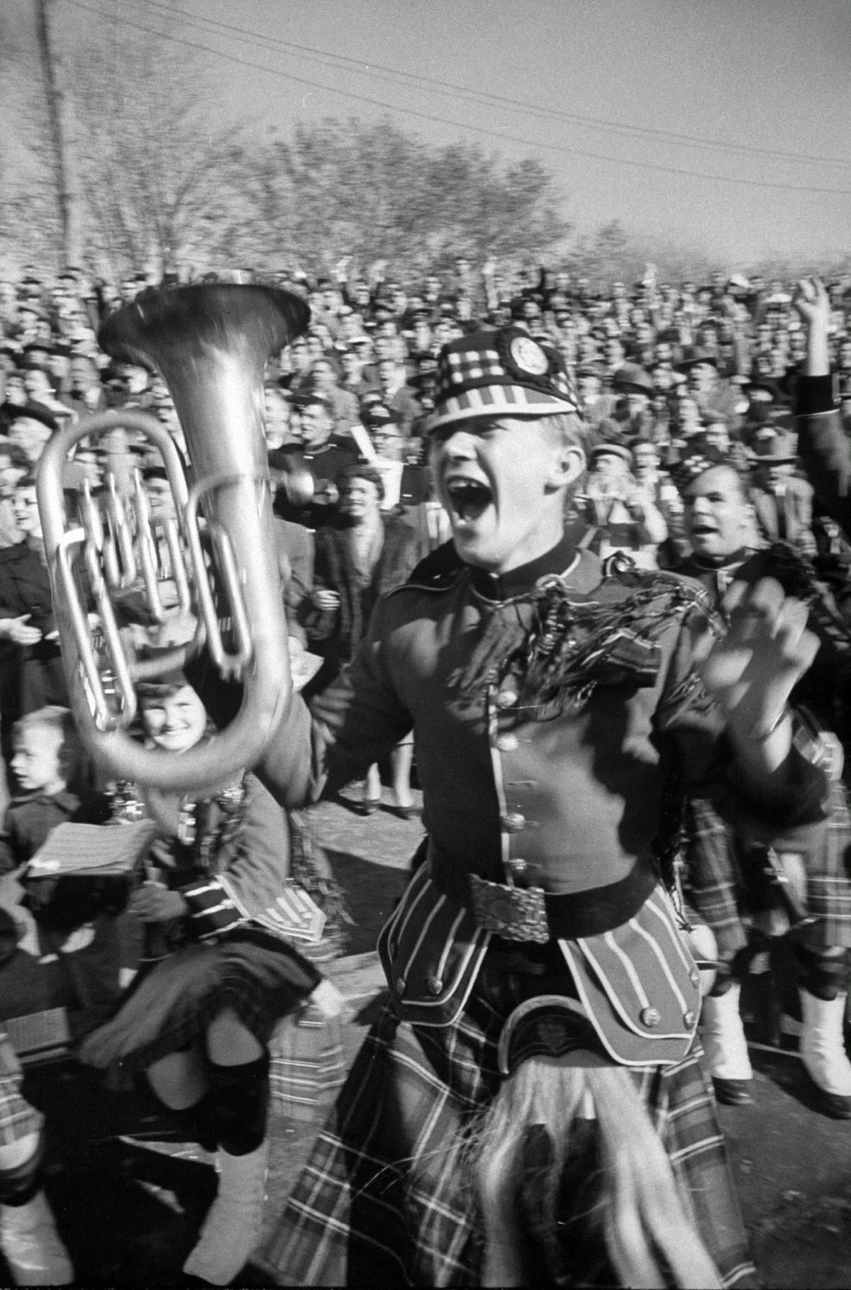 Walter Sokoluk waves his baritone horn with joy as Queen's scores again.