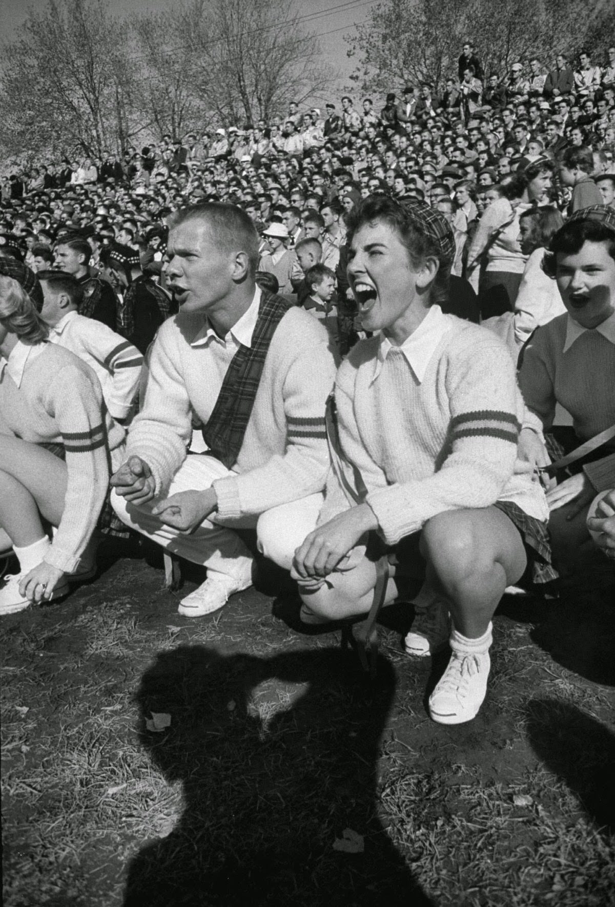 Queen's University (Ontario) cheerleaders at football game, 1954.