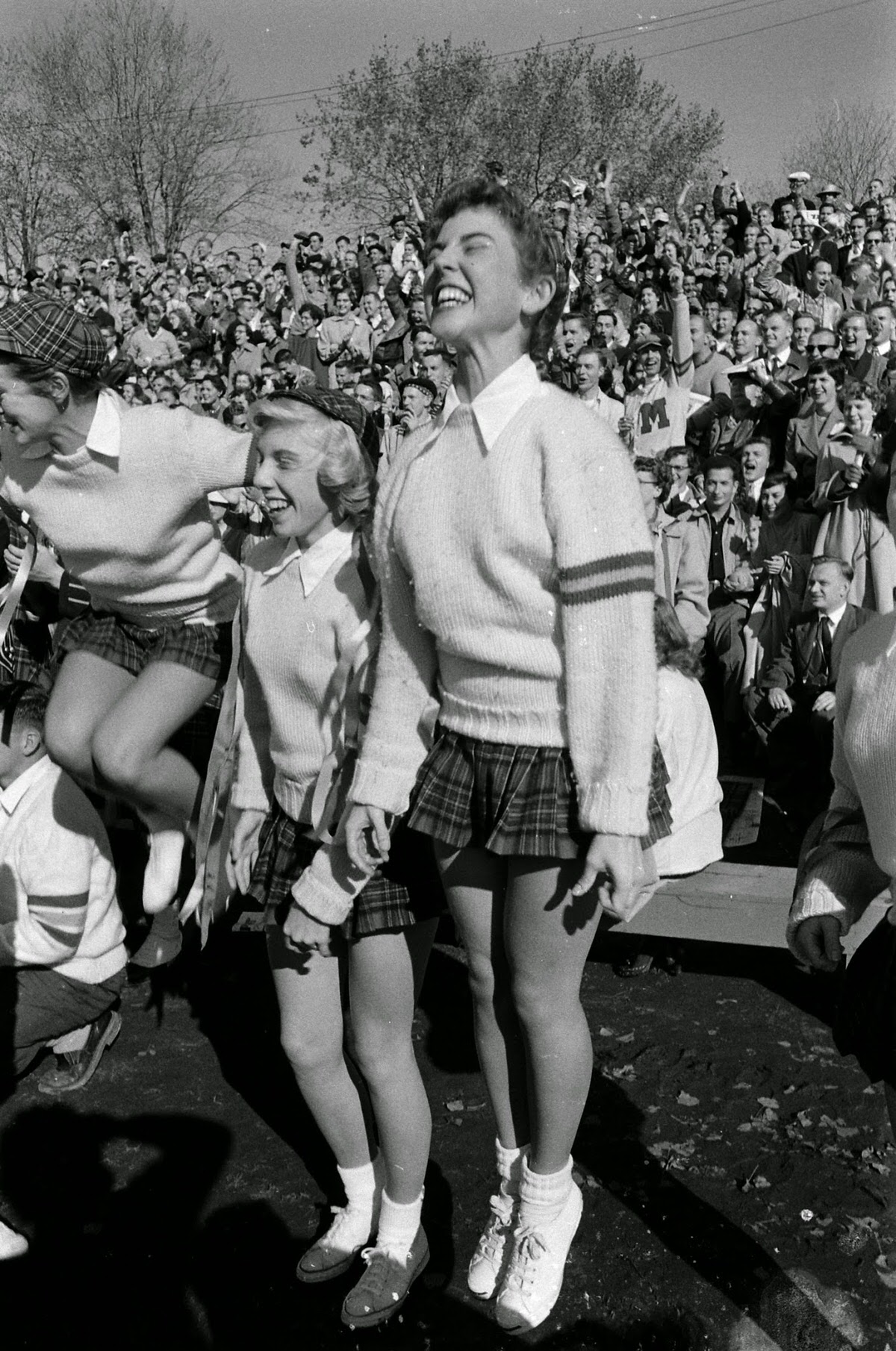 Queen's University (Ontario) cheerleaders at football game, 1954.