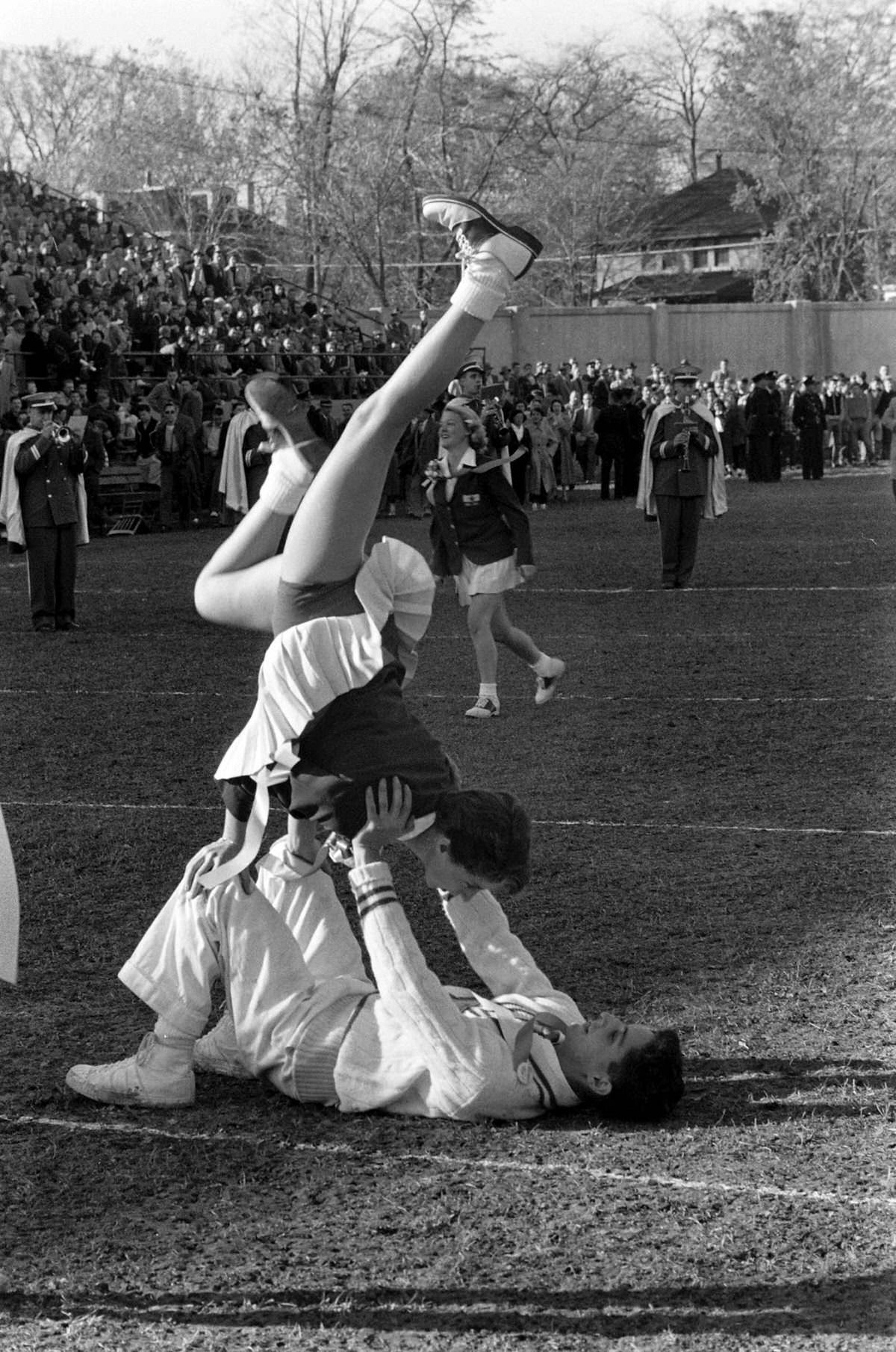 Cheerleaders at Canadian college football game, 1954.