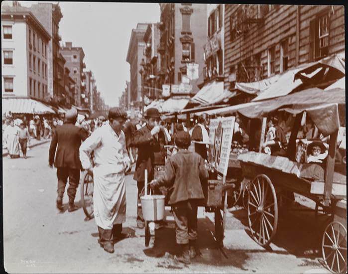 Man having a drink at a vendor's cart on Hester Street, 1898