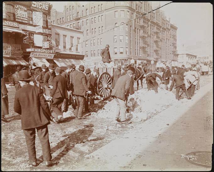 Workers carting snow on a New York street, 1898