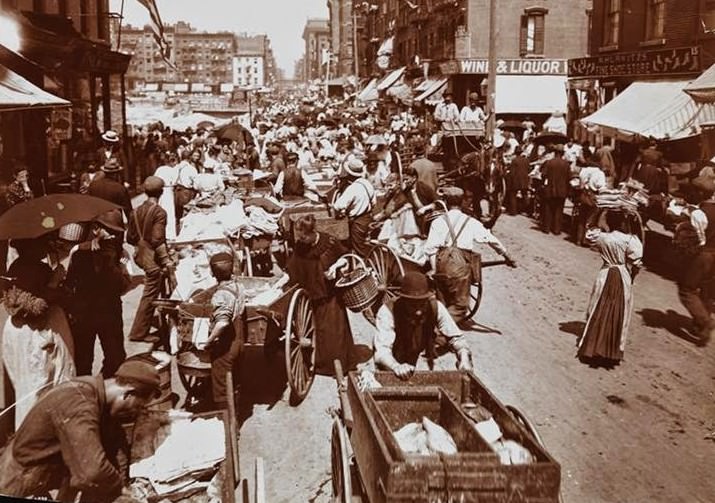Hester Street crowded with shoppers and pushcart peddlers, 1898