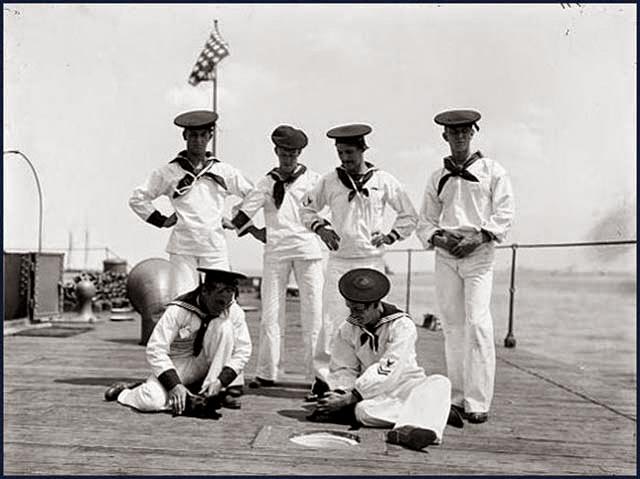 Crew of the USS Nahant with their two cats, ca 1898. The Nahant was an ironclad monitor that joined the fleet of Rear Admiral Samual Francis du Pont (for whom Washington, DC's Dupont Circle in named) in the attack on Charleston Harbor in 1863.