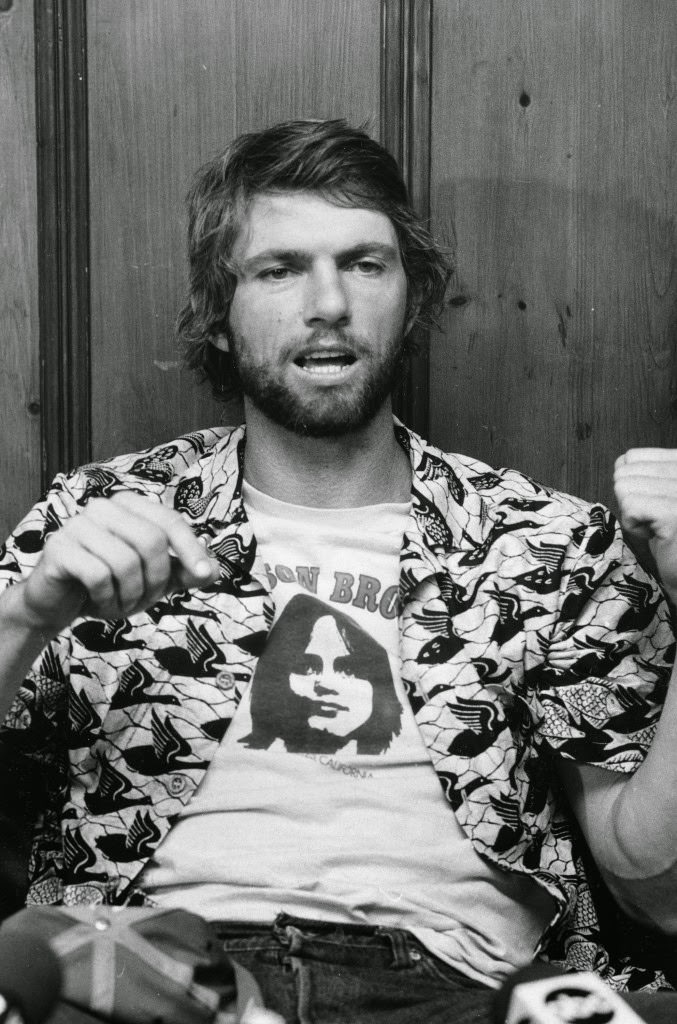 Montreal Expos pitcher Bill Lee, wearing a Jackson Browne t-shirt, talks to reporters in a news conference at the offices of the American Civil Liberties Union in New York City on Sept. 20, 1979. Lee was fined $250 by baseball commissioner Bowie Kuhn for marijuana use and is suing major league baseball in response, claiming abuse of his feedom of speech.