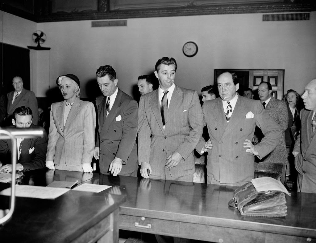 In this Feb. 9, 1949, actor Robert Mitchum, center right, and actress Lila Leeds, left, are sentenced to 60 days in jail on charges of conspiracy to possess marijuana cigarettes in Los Angeles.