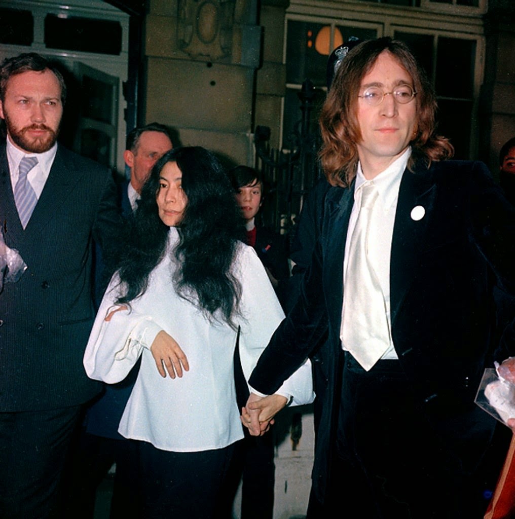 Beatle John Lennon, right, and companion Yoko Ono are arrested for possesion of marijuana after their flat was raided in London, England, on Oct. 18, 1968.