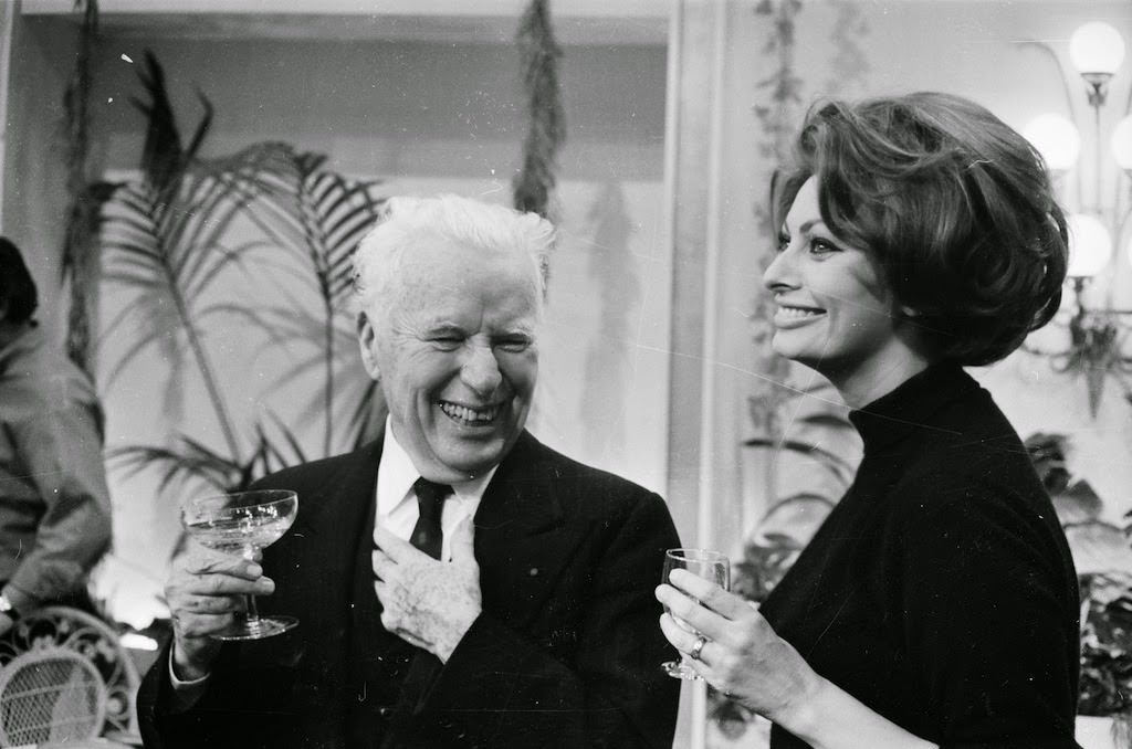 Charlie Chaplin with Sophia Loren at his birthday party in 1966.