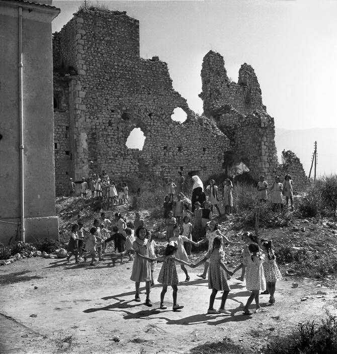Orphan girls playing amid the ruins of their former orphanage in Monte Cassino, 1948