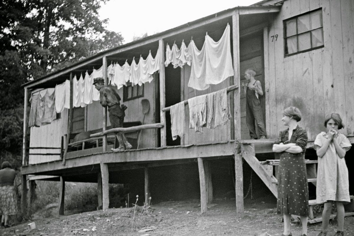 Coal miner's shack and some of his family