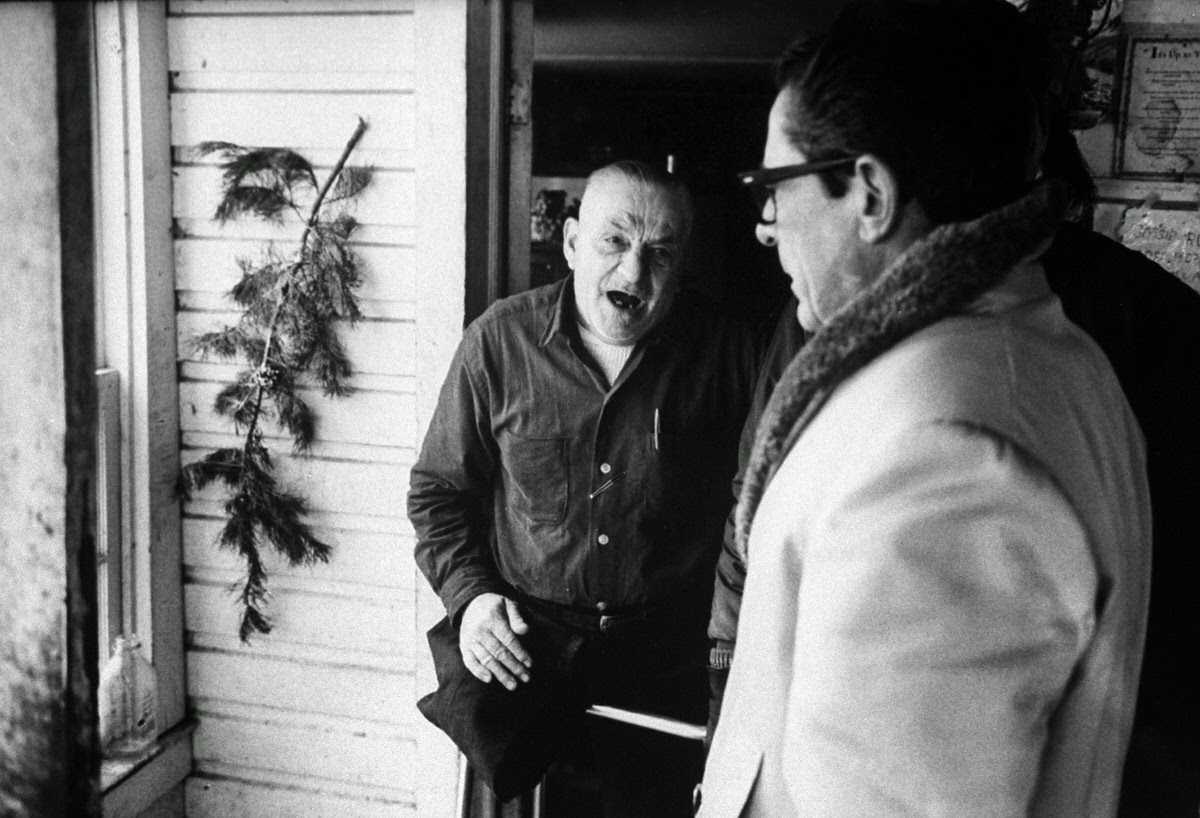 Aroused by early-morning raid on his animal compound at White Hall, Md., Lester Brown confronts Frank McMahon who represented the Humane Society.