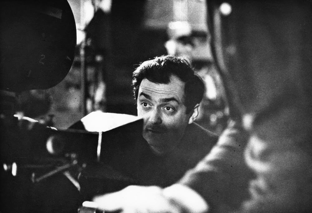 Kubrick watches through the viewfinder.