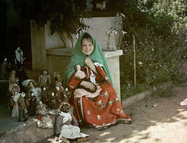 Girl with dolls, 1910