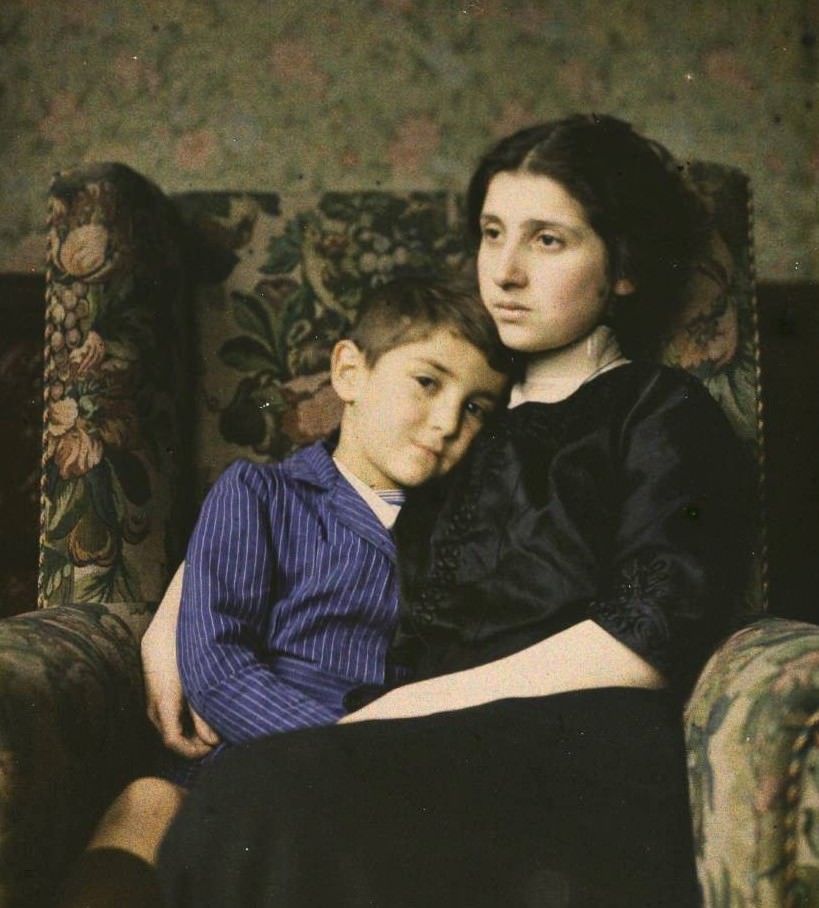 Woman and boy in a chair, 1915