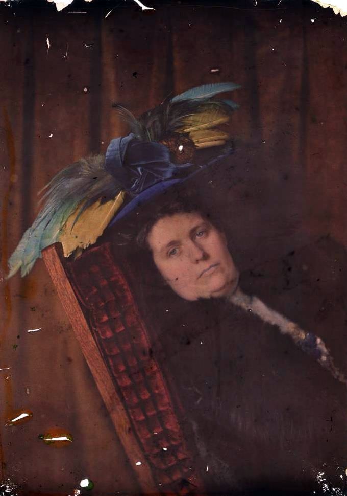 Woman wearing a pinecone and feather hat, 1910