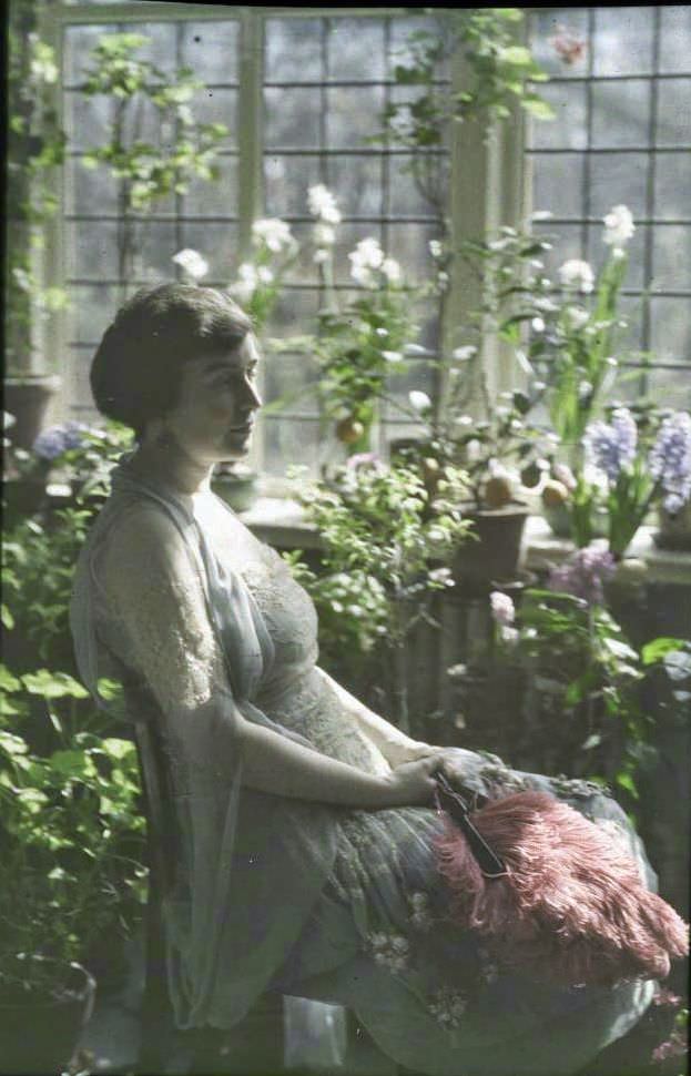 Woman in a greenhouse, 1910