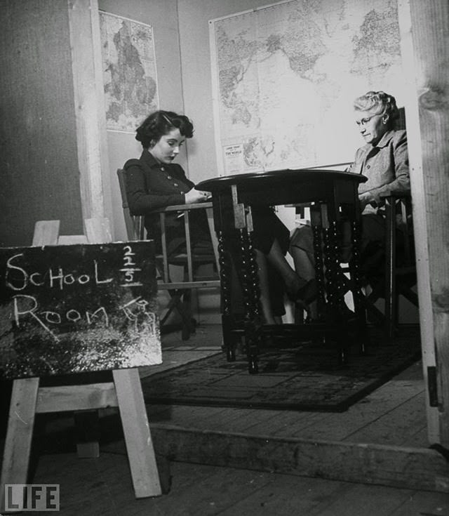 Taylor, age 16, works with her tutor on a movie set, 1948.