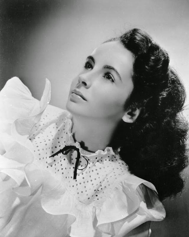 Elizabeth Taylor poses in a blouse with a polka dot yoke in 1944.