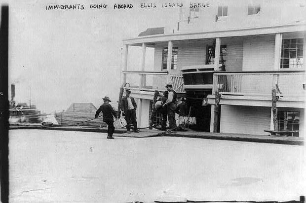 Immigrants boarding a ferry to Ellis Island, 1911