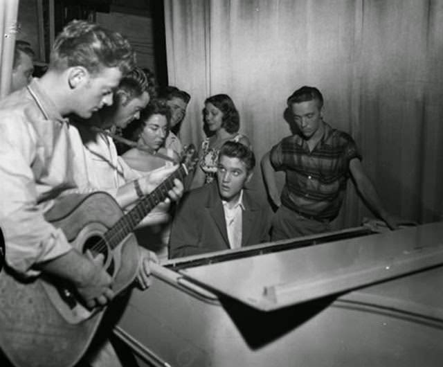 Elvis Presley backstage at the piano with Red West in Jacksonville, 1956