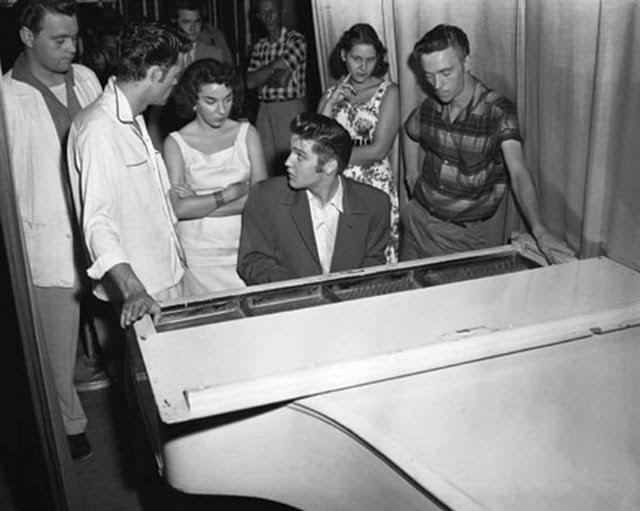 Elvis Presley backstage at the piano in Jacksonville, 1956