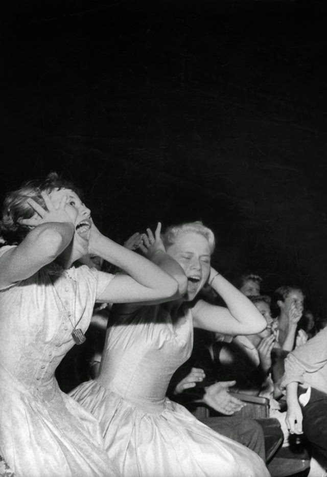 Teenage fans screaming during Elvis Presley's appearance at the Florida Theatre, 1956