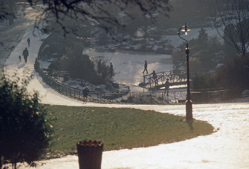 Frozen park pond, probably Mesnes Park in Wigan, 1966