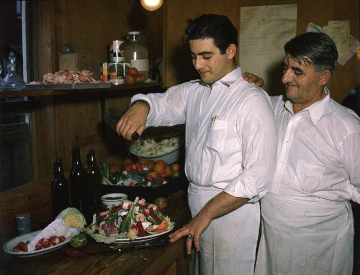 Louis and Michael Pappas preparing a Greek salad at the Riverside Cafe in Tarpon Springs, 1940s