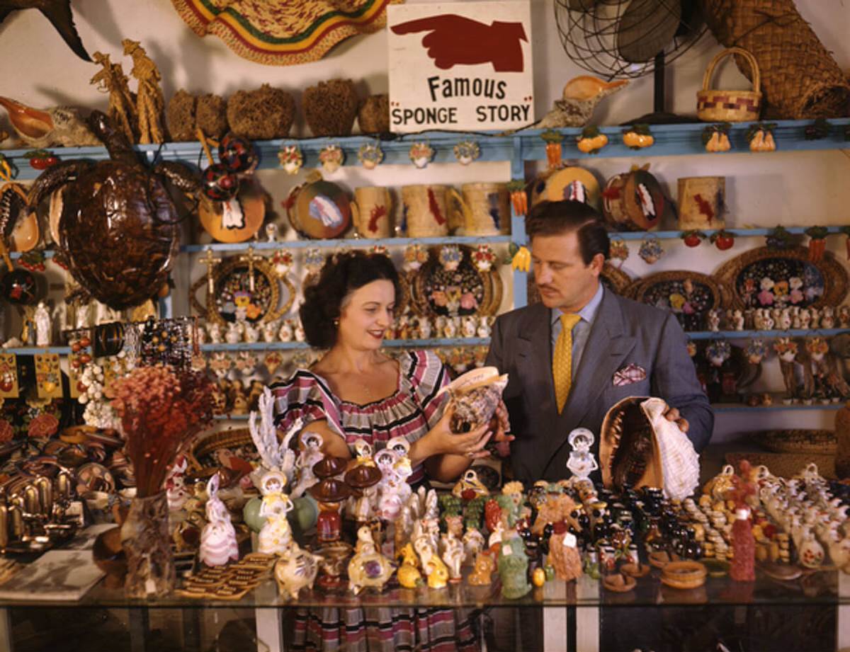 John M. Gonatos and assistant Niki Vasilikis in their curio shop in Tarpon Springs, 1940s